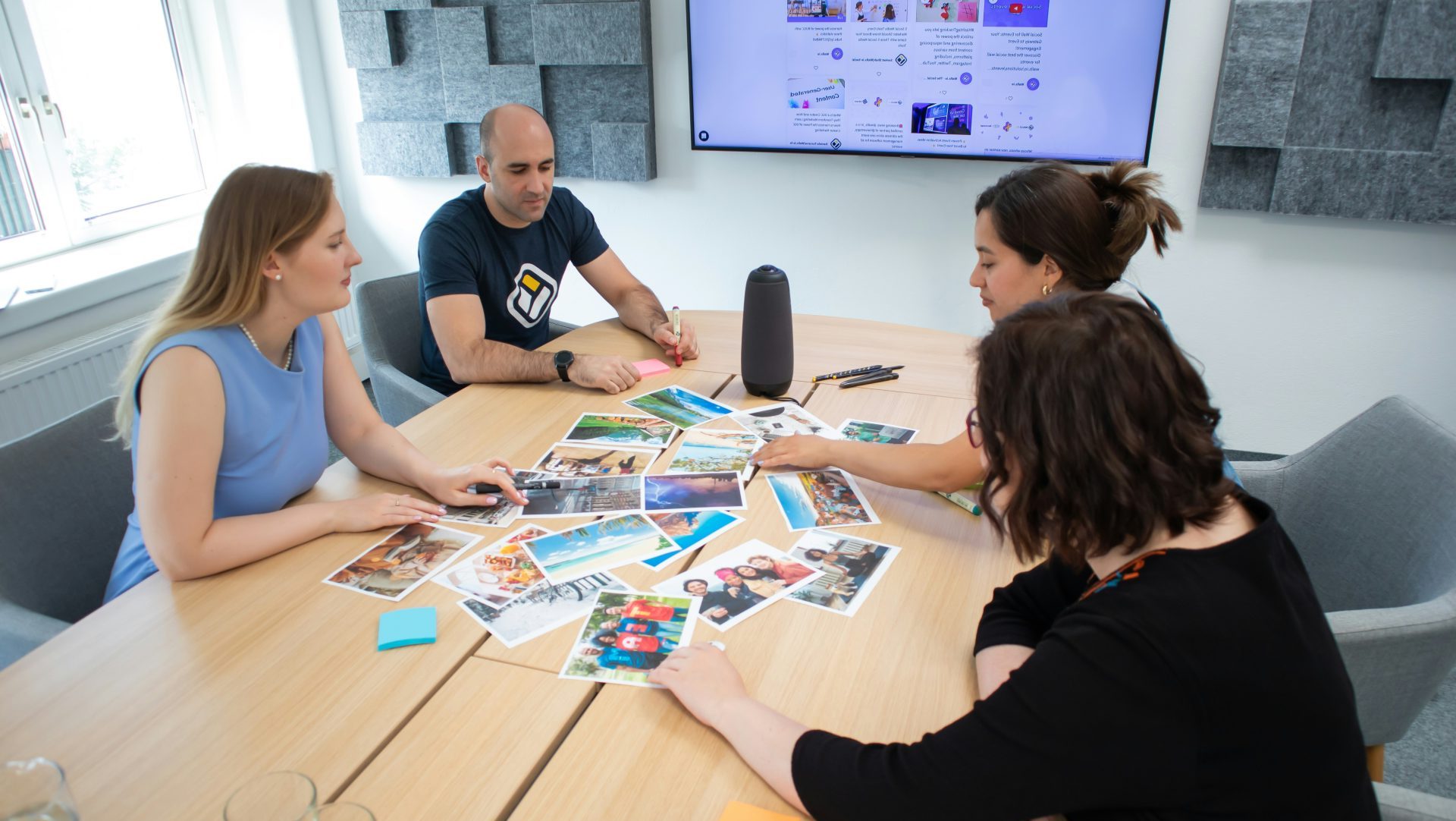 a group of people sitting around a wooden table